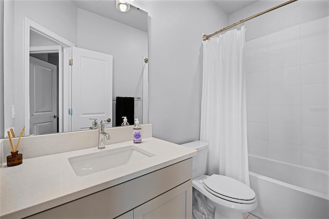 bathroom with toilet, vanity, and shower / tub combo