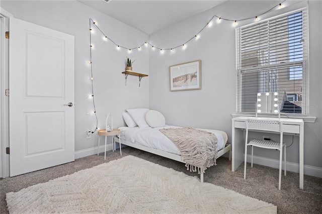 carpeted bedroom with baseboards