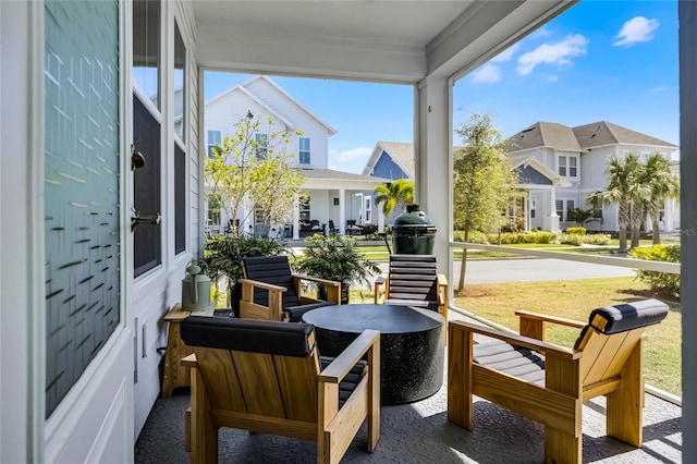 sunroom / solarium with a residential view