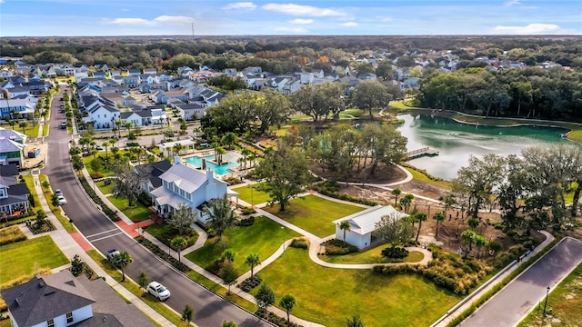 drone / aerial view with a water view and a residential view