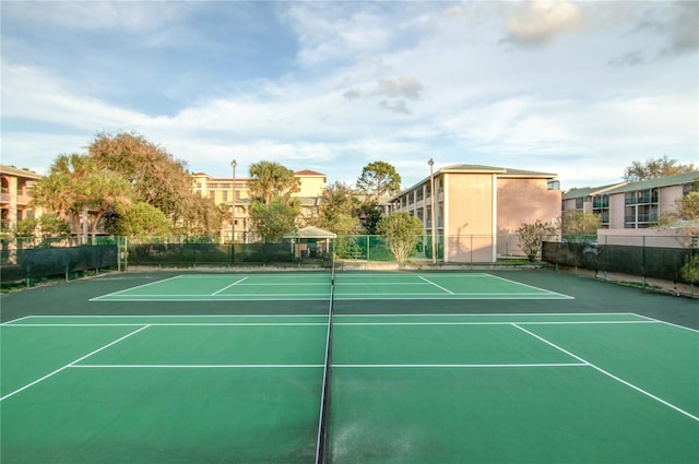 view of sport court featuring fence