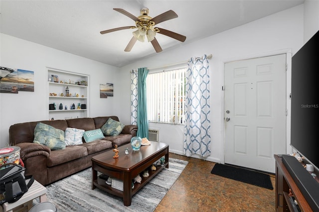 living area with a ceiling fan and baseboards