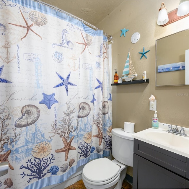 full bath featuring vanity, a shower with shower curtain, toilet, and a textured wall