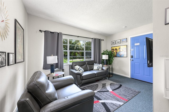 carpeted living area with a textured ceiling and baseboards