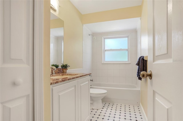 full bath with toilet, vanity, and  shower combination