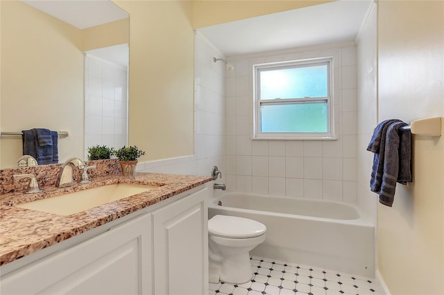 bathroom featuring vanity, tile patterned floors, toilet, and shower / bathtub combination