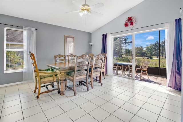 dining space featuring light tile patterned floors, a healthy amount of sunlight, lofted ceiling, and ceiling fan