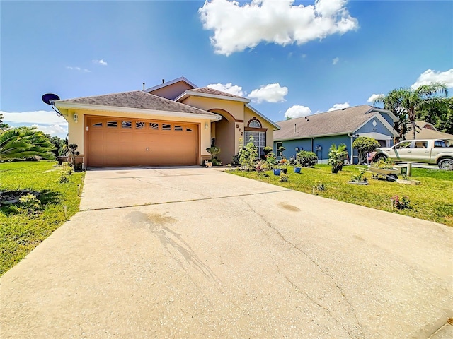 view of front facade featuring a front lawn, concrete driveway, a garage, and stucco siding