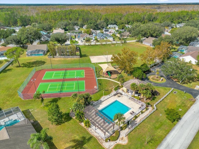 birds eye view of property with a view of trees