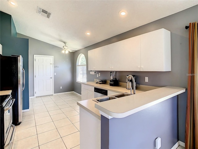 kitchen featuring light tile patterned floors, visible vents, a sink, stainless steel appliances, and light countertops