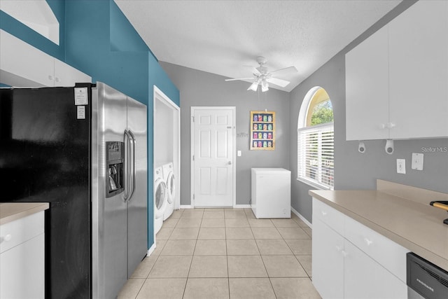 kitchen with washing machine and clothes dryer, stainless steel fridge with ice dispenser, light countertops, light tile patterned flooring, and fridge