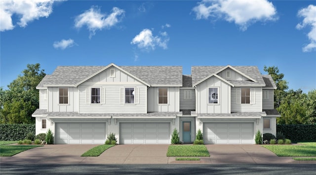 view of front of property featuring a garage, board and batten siding, driveway, and a shingled roof