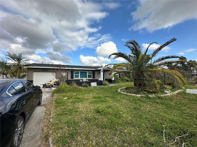 single story home with a garage, concrete driveway, and a front yard