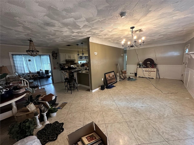 dining space with light tile patterned floors, visible vents, a textured ceiling, and an inviting chandelier