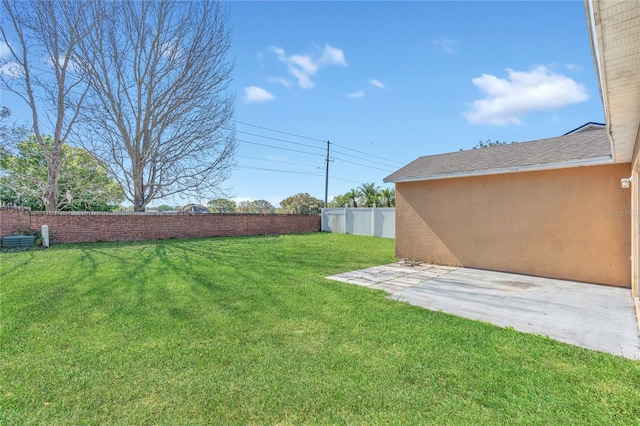 view of yard featuring a patio and a fenced backyard