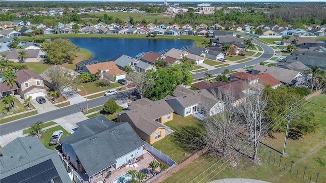 bird's eye view with a residential view and a water view