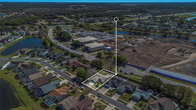 bird's eye view featuring a residential view and a water view