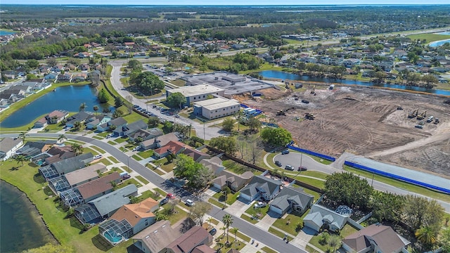 bird's eye view with a water view and a residential view