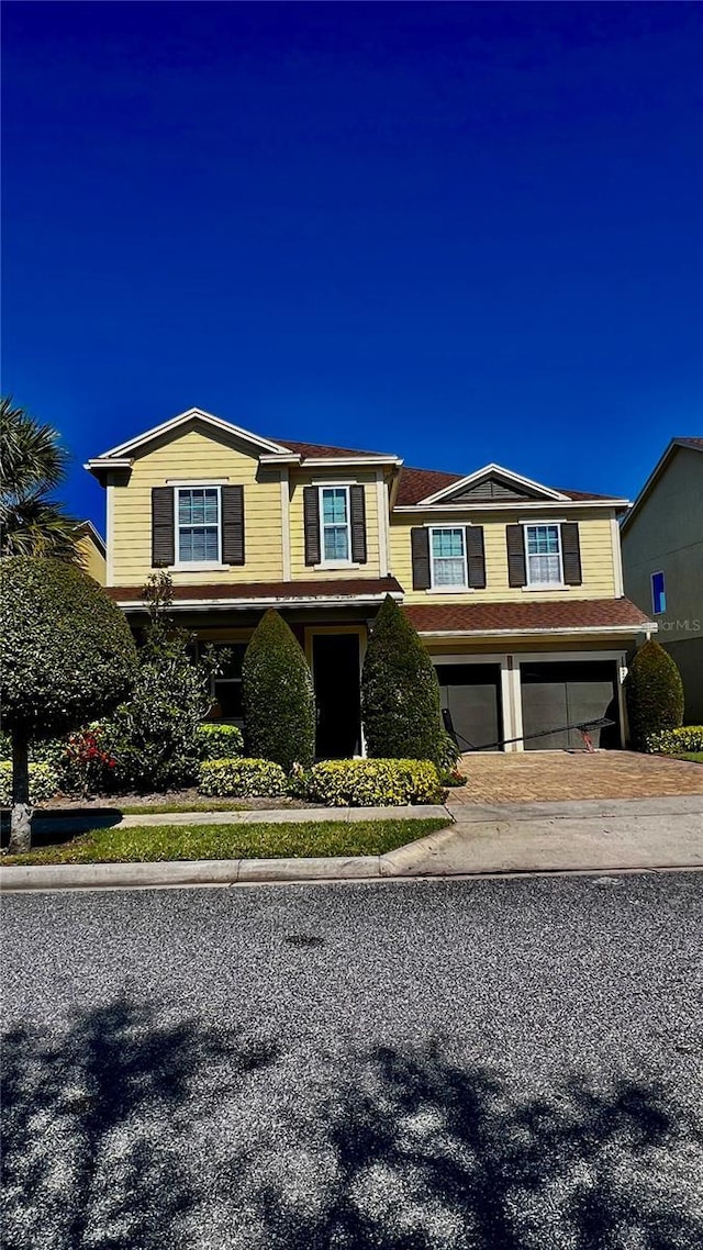 view of front of home featuring a garage and driveway