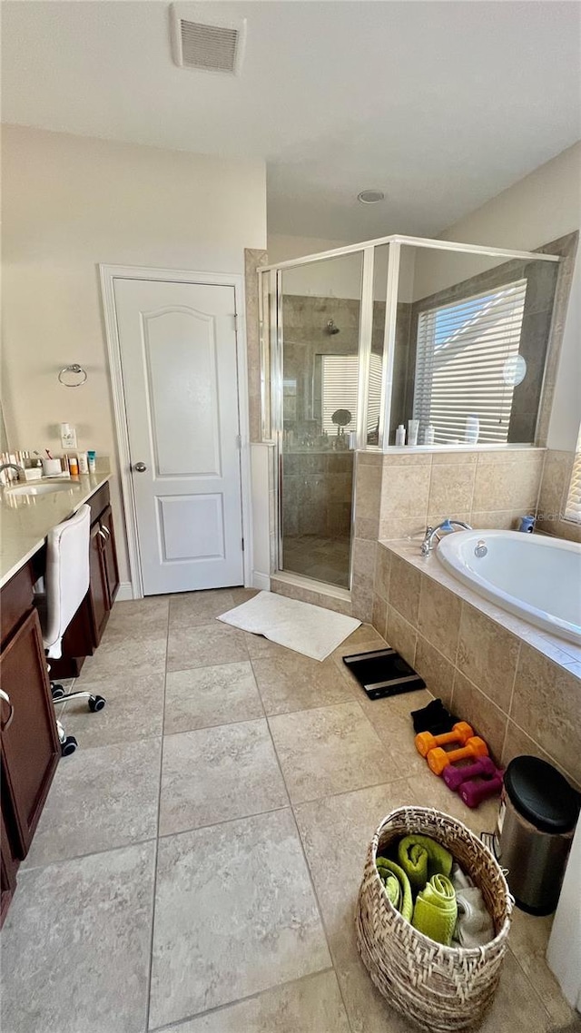 full bath with a bath, visible vents, and a stall shower