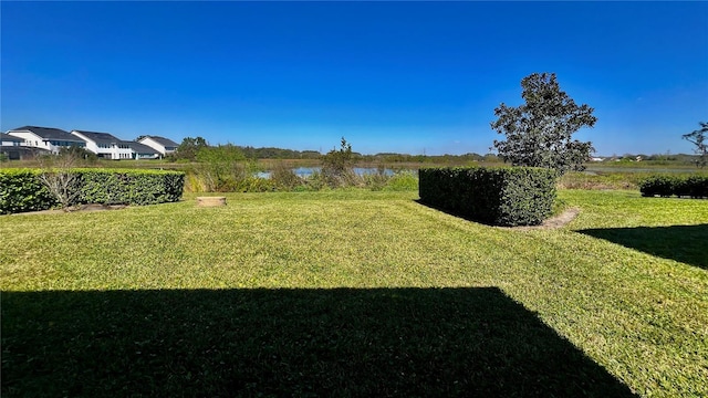 view of yard with a water view