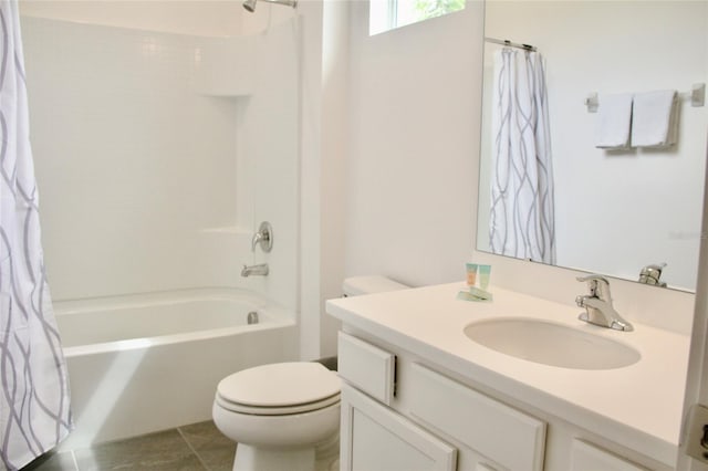 full bath featuring tile patterned floors, toilet, vanity, and shower / bath combo