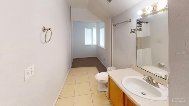 bathroom with vanity, tile patterned floors, toilet, and baseboards