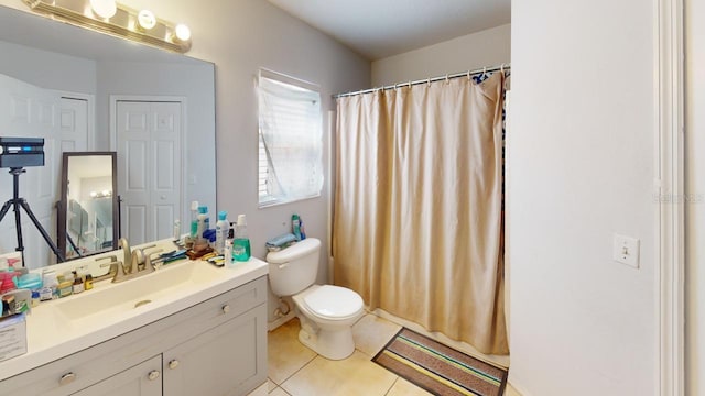 full bathroom featuring tile patterned flooring, curtained shower, toilet, and vanity