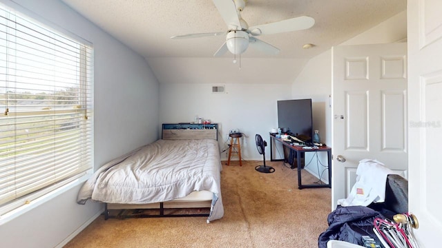 bedroom featuring visible vents, ceiling fan, baseboards, lofted ceiling, and light carpet