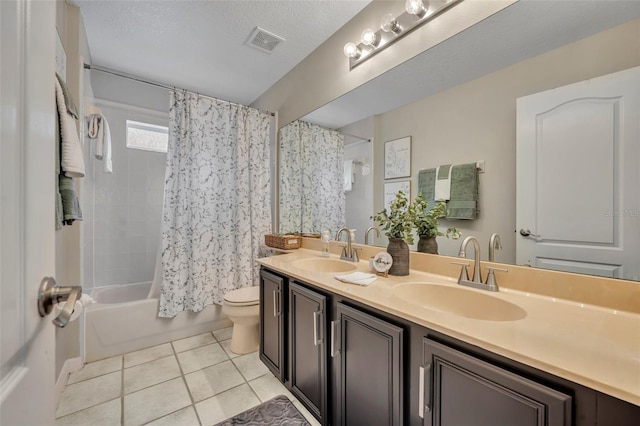 full bath featuring tile patterned floors, visible vents, toilet, and a sink