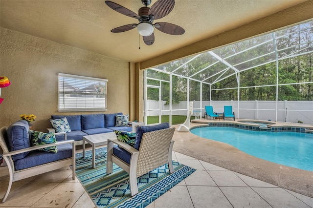 view of pool with a fenced backyard, glass enclosure, an outdoor hangout area, an in ground hot tub, and a patio area