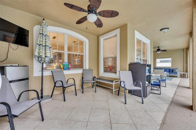 view of patio / terrace with an outdoor living space and ceiling fan