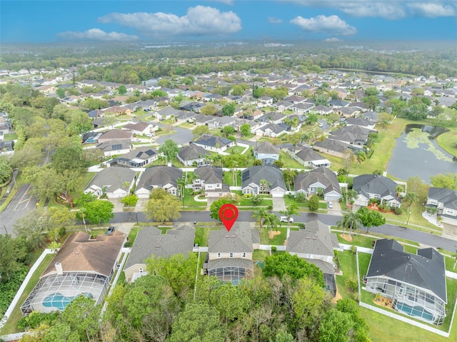 birds eye view of property featuring a residential view and a water view