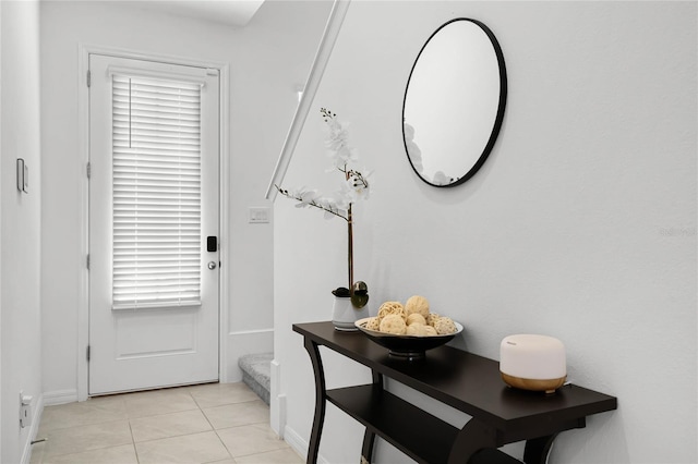 doorway to outside featuring light tile patterned floors