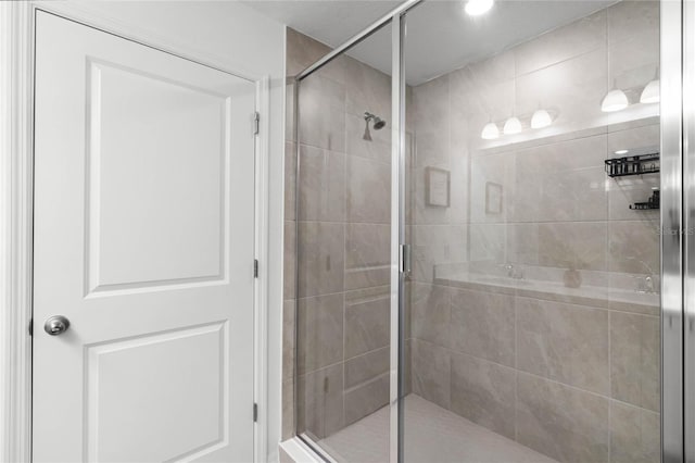 bathroom with a shower stall