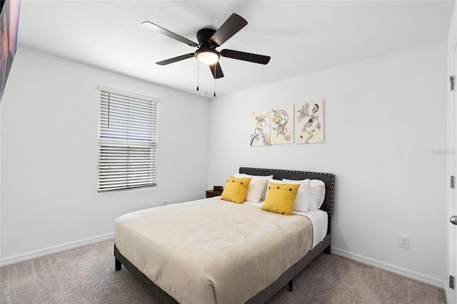 bedroom featuring baseboards, carpet floors, and ceiling fan