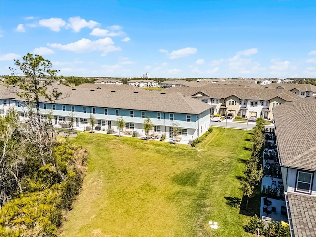 birds eye view of property with a residential view