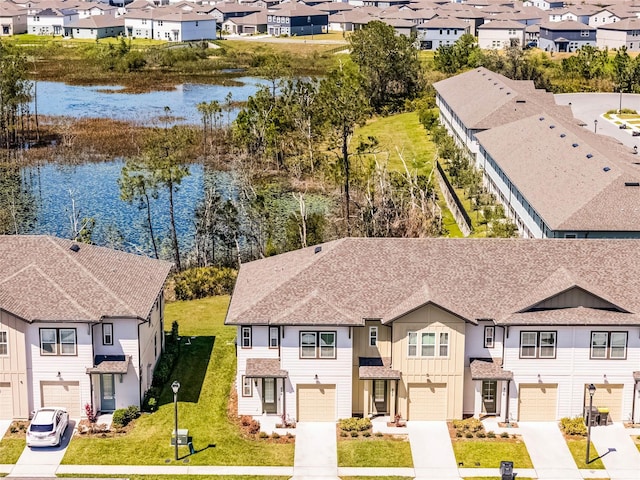 bird's eye view with a residential view and a water view