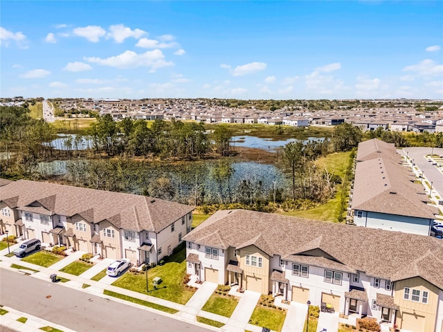 aerial view with a residential view and a water view