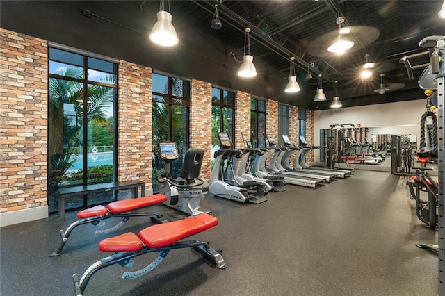 exercise room with brick wall