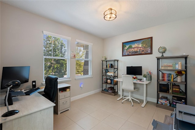 office with light tile patterned floors and baseboards