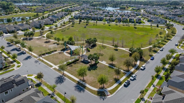 bird's eye view with a residential view and a water view