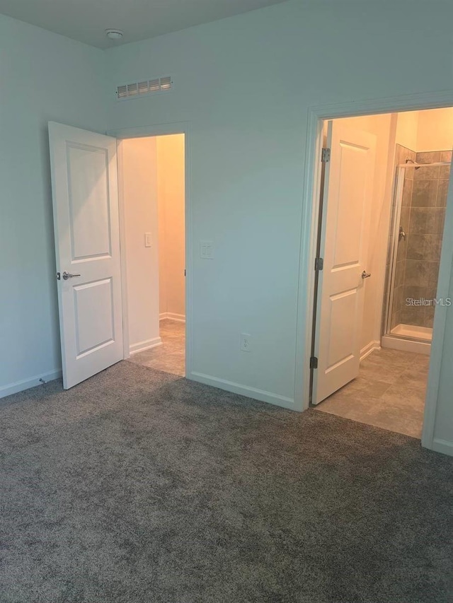 unfurnished bedroom with visible vents and carpet