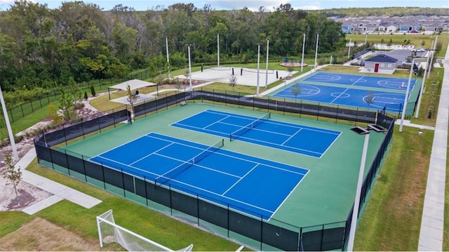 view of sport court featuring fence