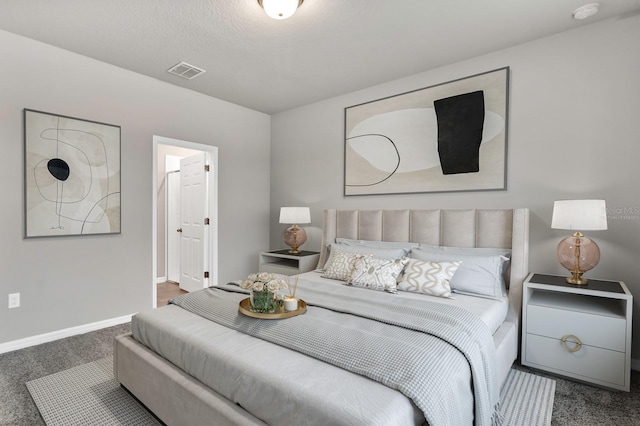 carpeted bedroom with baseboards and visible vents