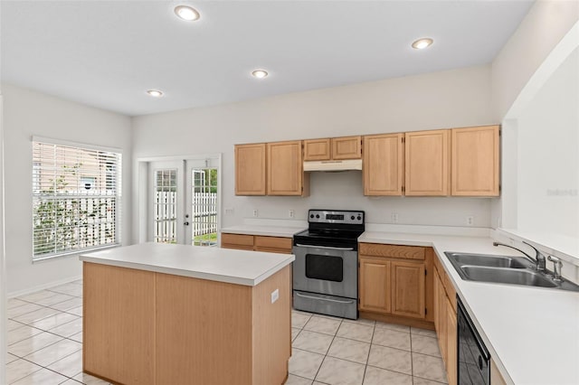 kitchen with under cabinet range hood, light countertops, black dishwasher, stainless steel range with electric stovetop, and a sink