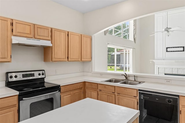 kitchen featuring stainless steel electric stove, a sink, under cabinet range hood, dishwasher, and a wealth of natural light