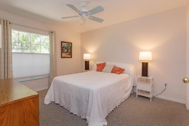 bedroom featuring carpet flooring, a ceiling fan, and baseboards