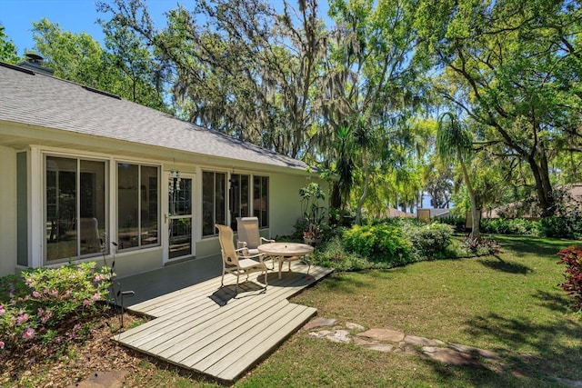 view of yard with a deck