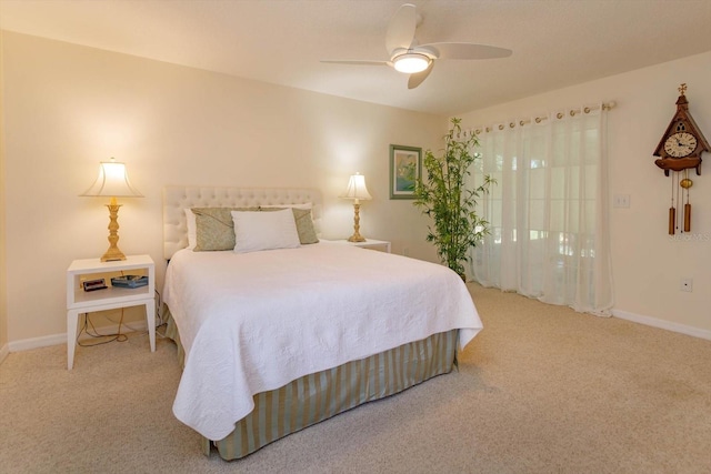 bedroom featuring baseboards, ceiling fan, and carpet